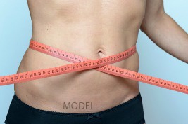 talk to a cosmetic surgeon about tummy tuck surgery